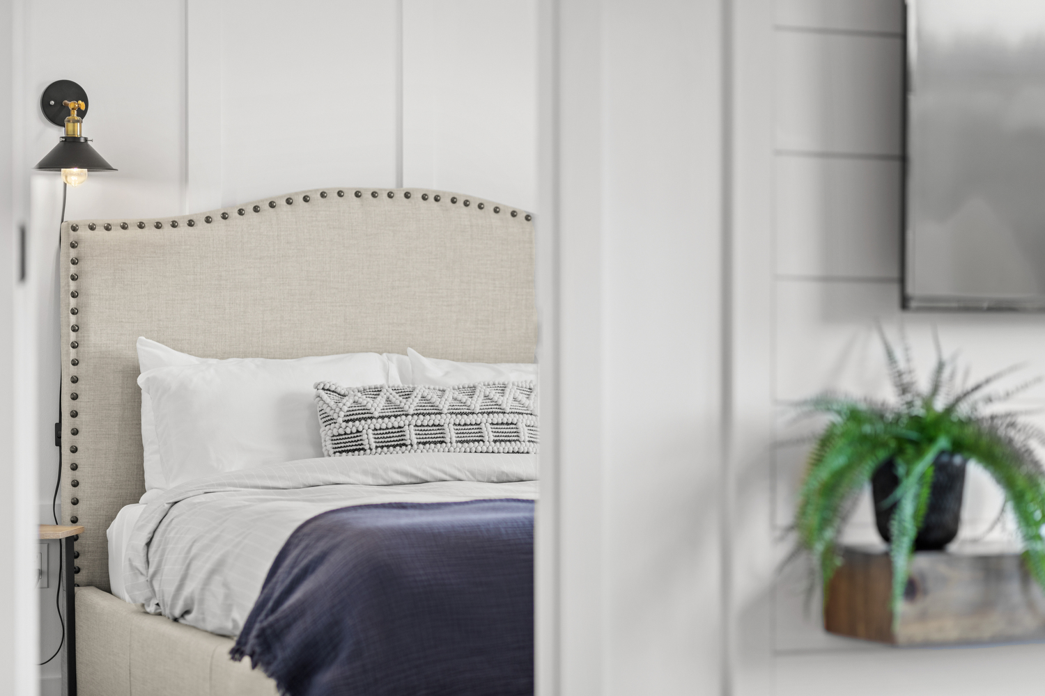 Primary Bedroom Queen Bed with Studded Headboard